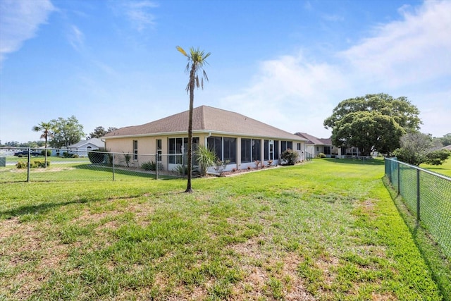 view of yard with a sunroom