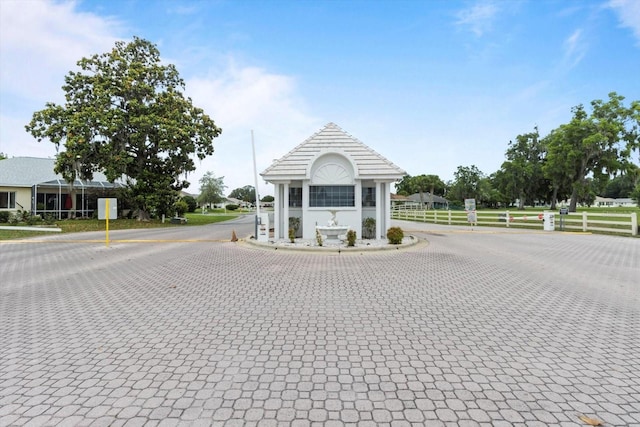 view of front of house featuring fence