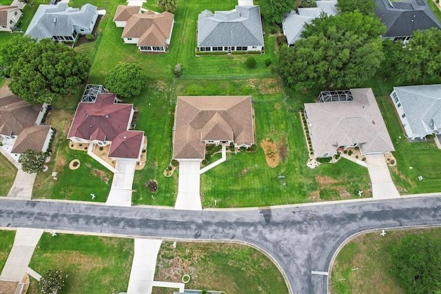aerial view of property and surrounding area featuring nearby suburban area