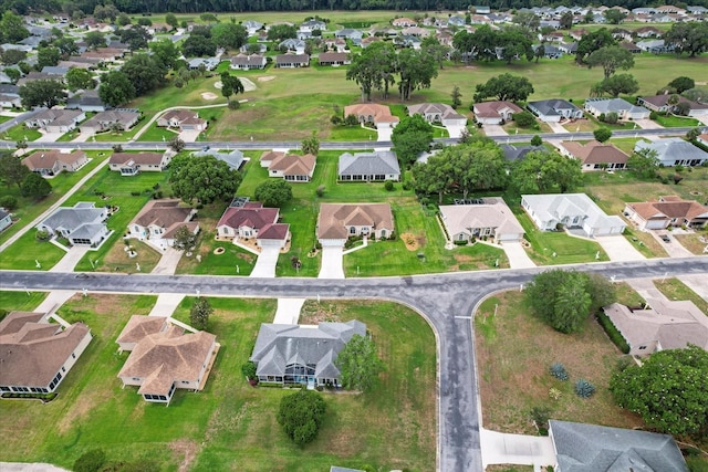 aerial view of property and surrounding area featuring nearby suburban area