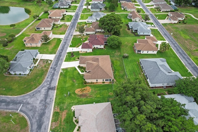 aerial view of property's location featuring nearby suburban area and a nearby body of water