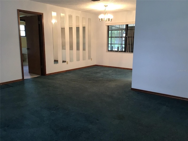 3152 Clewiston St, Deltona, FL 32738 - empty room featuring a chandelier, dark carpet, and baseboards