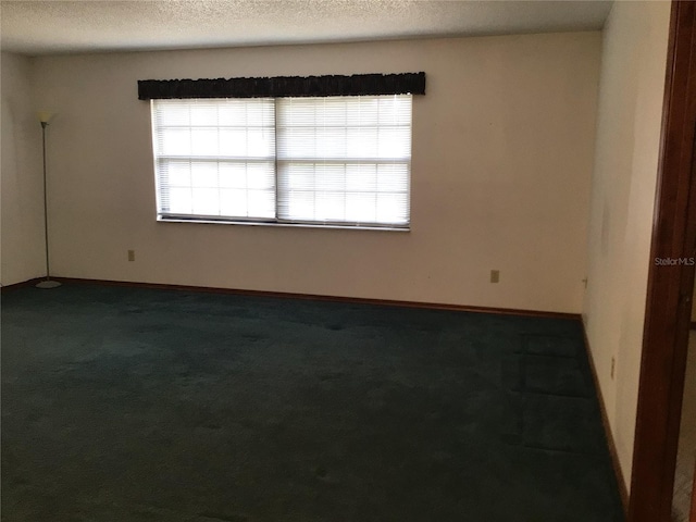 3152 Clewiston St, Deltona, FL 32738 - empty room with carpet flooring, a textured ceiling, and baseboards