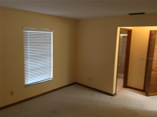3152 Clewiston St, Deltona, FL 32738 - spare room with baseboards and light carpet