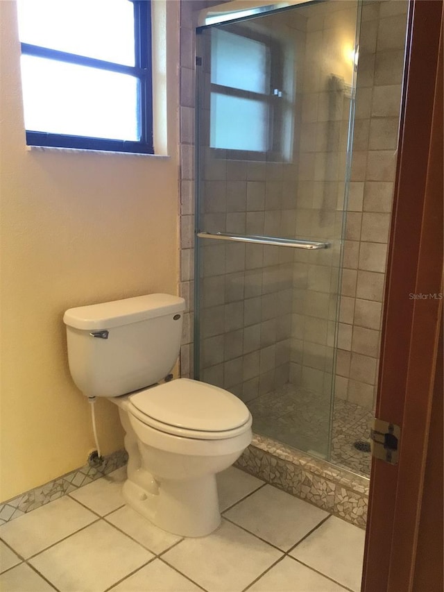 3152 Clewiston St, Deltona, FL 32738 - full bathroom featuring tile patterned flooring, a shower stall, and toilet