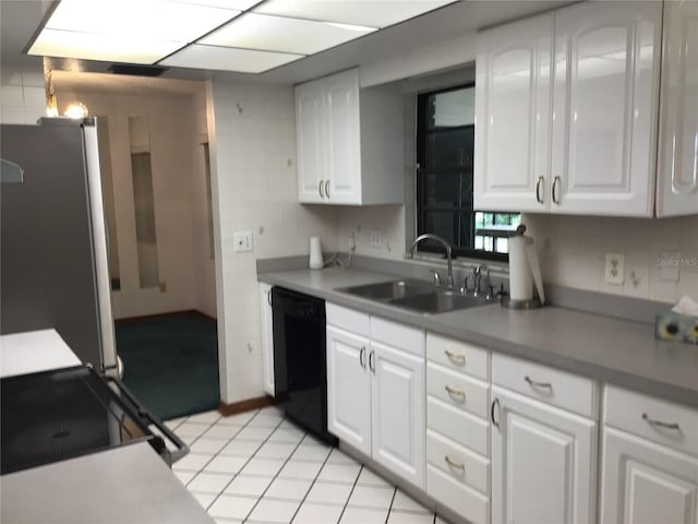 3152 Clewiston St, Deltona, FL 32738 - kitchen featuring black appliances, a sink, white cabinets, and light tile patterned floors