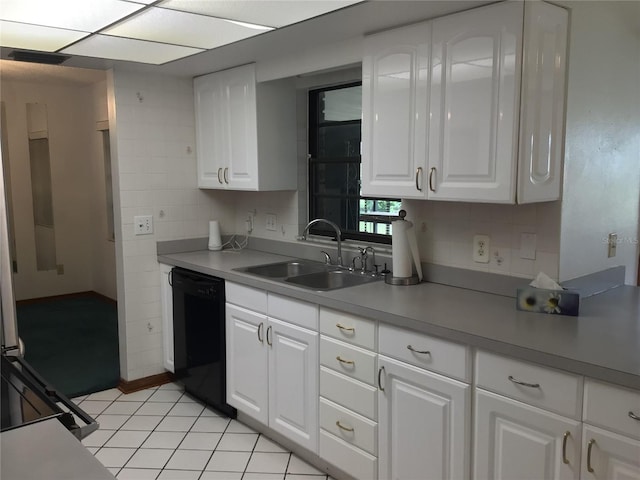 3152 Clewiston St, Deltona, FL 32738 - kitchen with black dishwasher, a sink, white cabinets, and light tile patterned floors