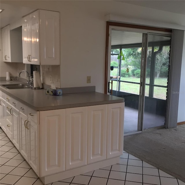 3152 Clewiston St, Deltona, FL 32738 - kitchen featuring a sink, white cabinets, and light tile patterned flooring