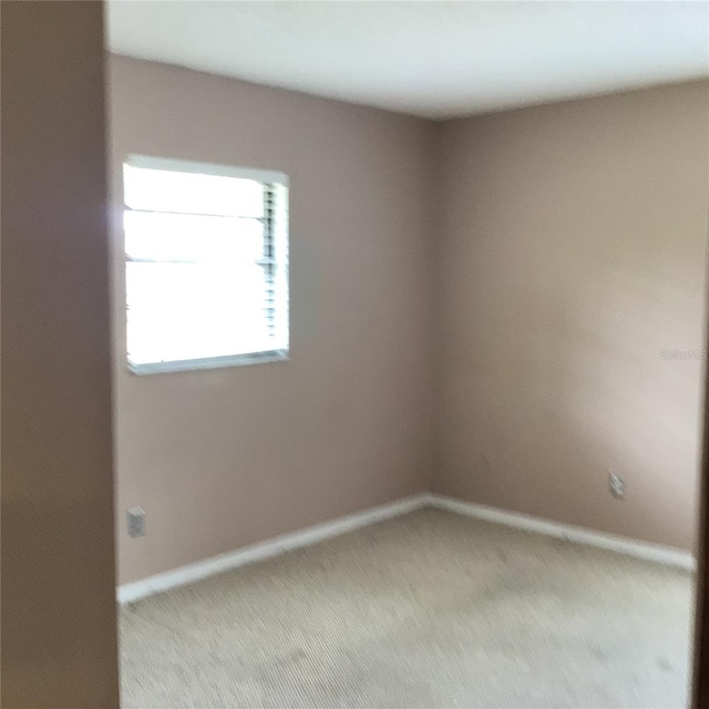 3152 Clewiston St, Deltona, FL 32738 - empty room featuring light carpet and baseboards