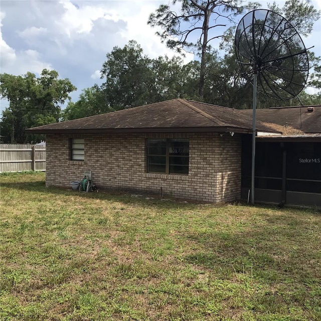 3152 Clewiston St, Deltona, FL 32738 - view of property exterior featuring brick siding and roof with shingles