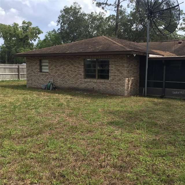 3152 Clewiston St, Deltona, FL 32738 - back of house featuring brick siding and a sunroom