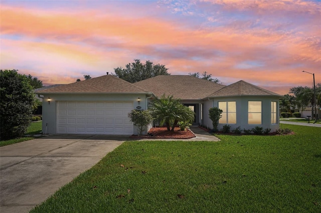 26609 Bull Run, Leesburg, FL 34748 - single story home with driveway, a lawn, a garage, and stucco siding