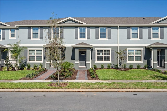 17081 Water Spring Blvd, Winter Garden, FL 34787 - multi unit property with stucco siding and a front yard