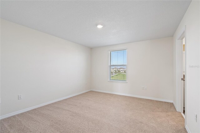17081 Water Spring Blvd, Winter Garden, FL 34787 - empty room featuring light colored carpet, baseboards, and recessed lighting