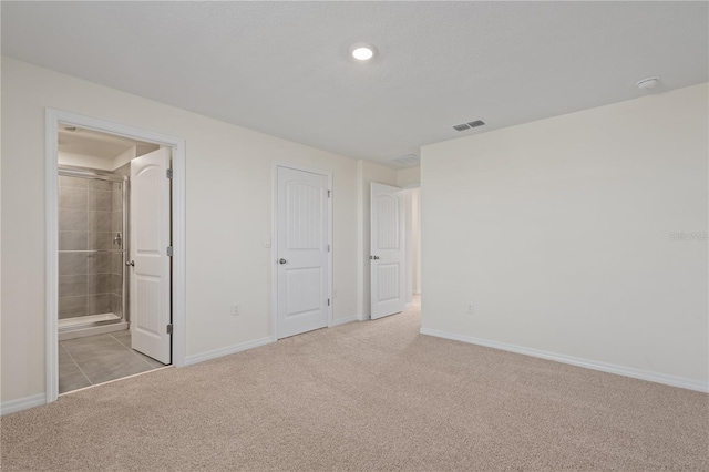 17081 Water Spring Blvd, Winter Garden, FL 34787 - unfurnished bedroom with light colored carpet, baseboards, ensuite bath, and recessed lighting