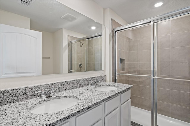 17081 Water Spring Blvd, Winter Garden, FL 34787 - bathroom featuring a stall shower, double vanity, and recessed lighting