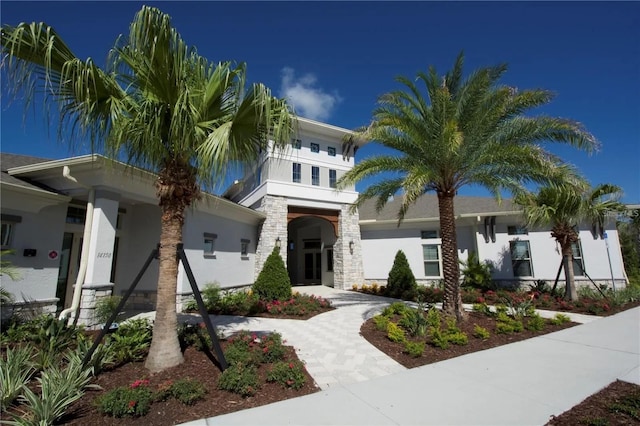 17081 Water Spring Blvd, Winter Garden, FL 34787 - view of front of house with stucco siding and stone siding
