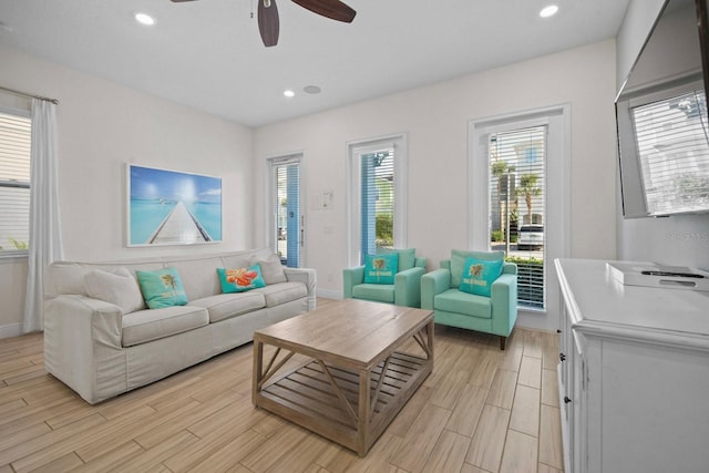 8045 Lost Shaker Ln, Kissimmee, FL 34747 - living room featuring ceiling fan, plenty of natural light, light wood-style flooring, and recessed lighting