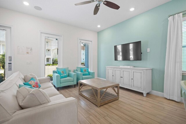 8045 Lost Shaker Ln, Kissimmee, FL 34747 - living area featuring a ceiling fan, light wood-style floors, and recessed lighting