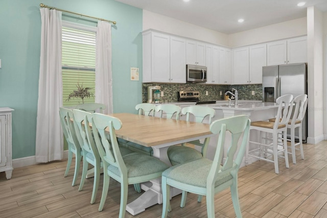 8045 Lost Shaker Ln, Kissimmee, FL 34747 - dining area featuring light wood-type flooring and recessed lighting