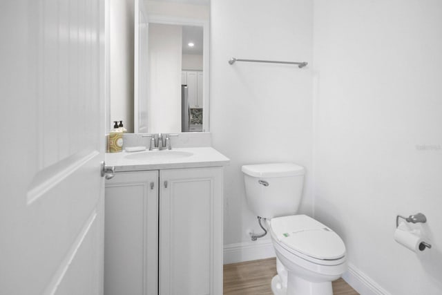 8045 Lost Shaker Ln, Kissimmee, FL 34747 - half bath featuring vanity and wood finished floors