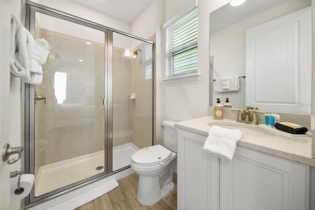 8045 Lost Shaker Ln, Kissimmee, FL 34747 - bathroom featuring vanity, a shower stall, and wood finished floors