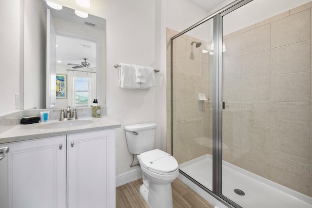 8045 Lost Shaker Ln, Kissimmee, FL 34747 - bathroom featuring vanity, a stall shower, wood finished floors, and ceiling fan
