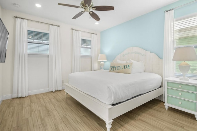 8045 Lost Shaker Ln, Kissimmee, FL 34747 - bedroom with light wood finished floors, ceiling fan, and recessed lighting