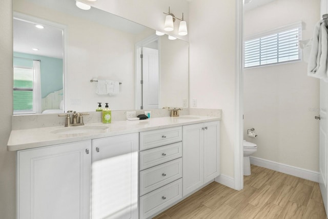 8045 Lost Shaker Ln, Kissimmee, FL 34747 - bathroom with double vanity and toilet