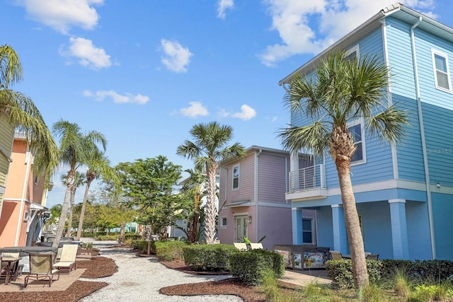 8045 Lost Shaker Ln, Kissimmee, FL 34747 - view of community with a patio area