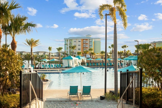 8045 Lost Shaker Ln, Kissimmee, FL 34747 - community pool featuring a patio area