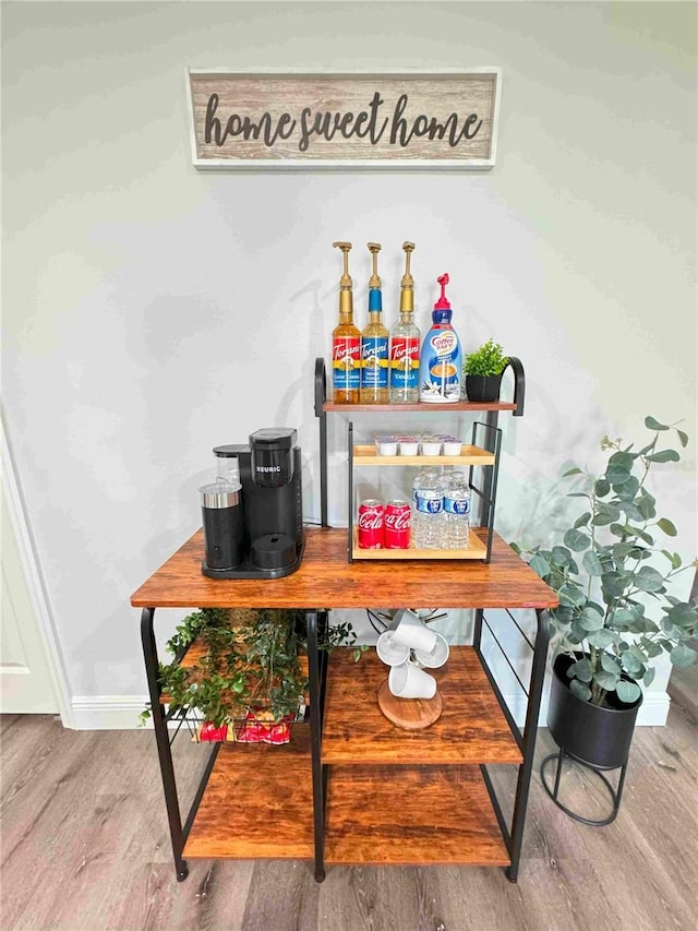 bar with wood finished floors and baseboards