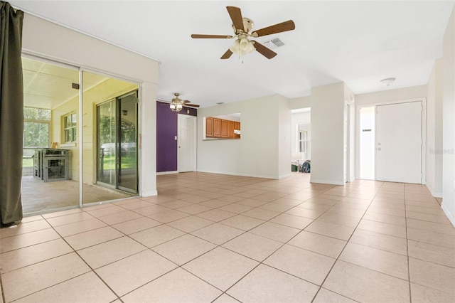 715 Wedge Ln, Poinciana, FL 34759 - unfurnished living room with ceiling fan, light tile patterned flooring, baseboards, and a fireplace