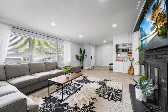 913 Moss Ln, Winter Park, FL 32789 - living room featuring a fireplace, ornamental molding, and recessed lighting