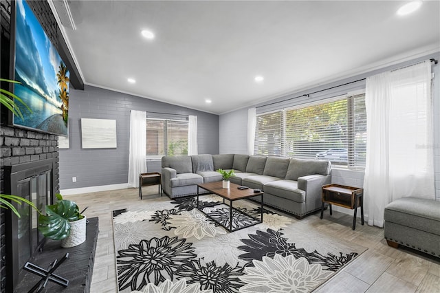 913 Moss Ln, Winter Park, FL 32789 - living area featuring crown molding, lofted ceiling, a brick fireplace, wood finished floors, and recessed lighting