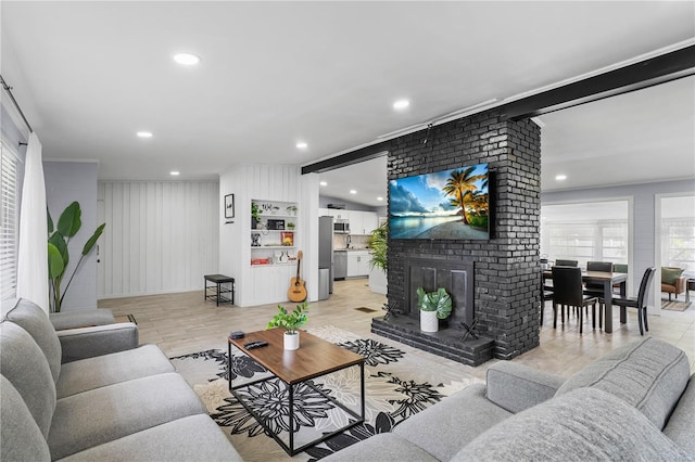 913 Moss Ln, Winter Park, FL 32789 - living room featuring a fireplace, recessed lighting, and light wood-type flooring