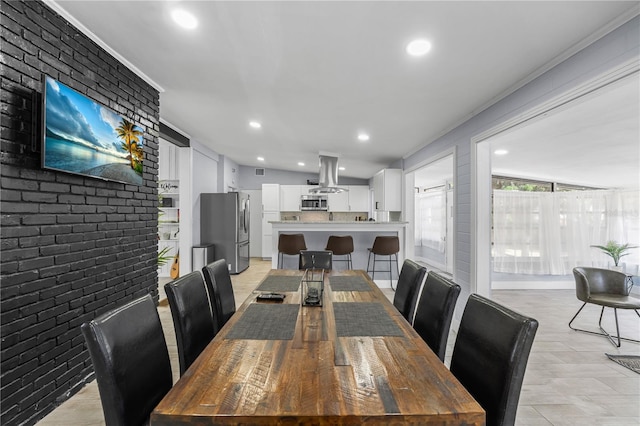 913 Moss Ln, Winter Park, FL 32789 - dining area featuring brick wall and recessed lighting