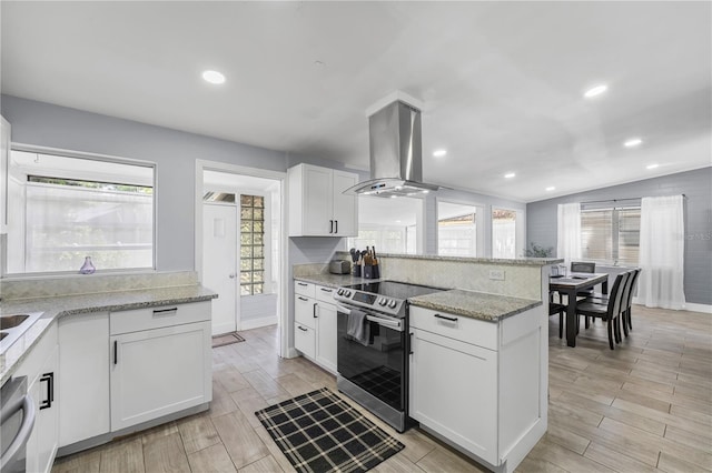913 Moss Ln, Winter Park, FL 32789 - kitchen with electric stove, island exhaust hood, white cabinets, light stone countertops, and light wood-type flooring