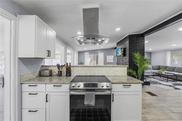 913 Moss Ln, Winter Park, FL 32789 - kitchen featuring stainless steel range with electric stovetop, island range hood, open floor plan, a peninsula, and white cabinetry