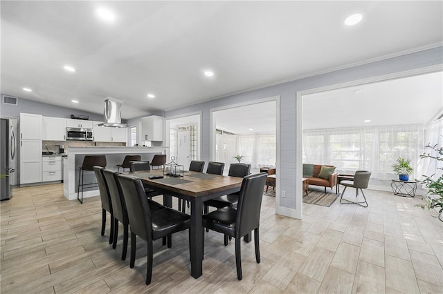 913 Moss Ln, Winter Park, FL 32789 - dining space with light wood finished floors and recessed lighting