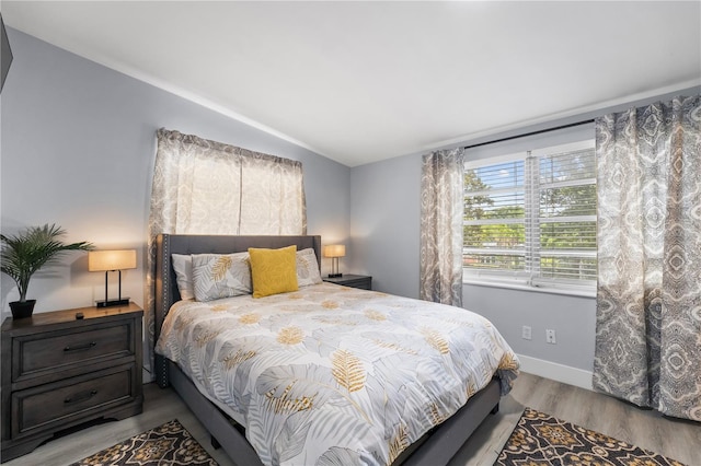 913 Moss Ln, Winter Park, FL 32789 - bedroom featuring lofted ceiling and wood finished floors