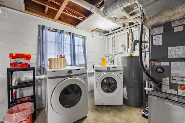 913 Moss Ln, Winter Park, FL 32789 - washroom featuring water heater, washing machine and clothes dryer, concrete block wall, and heating unit