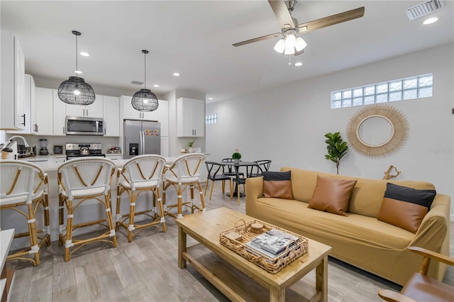 18 S D St, Lake Worth, FL 33460 - living room with ceiling fan, light wood-style floors, and recessed lighting