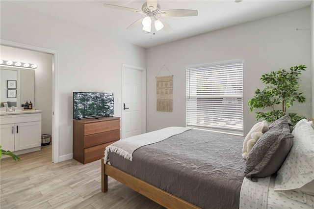 18 S D St, Lake Worth, FL 33460 - bedroom featuring light wood-style flooring, ensuite bath, ceiling fan, and baseboards