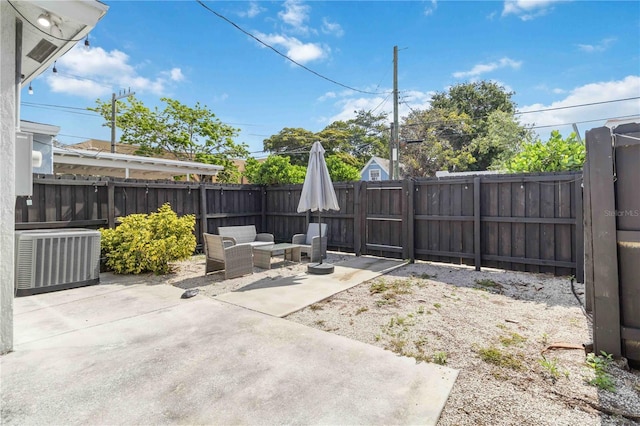 18 S D St, Lake Worth, FL 33460 - view of patio featuring cooling unit and a fenced backyard