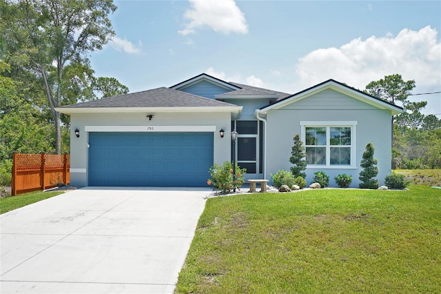 ranch-style home with a garage, driveway, and stucco siding