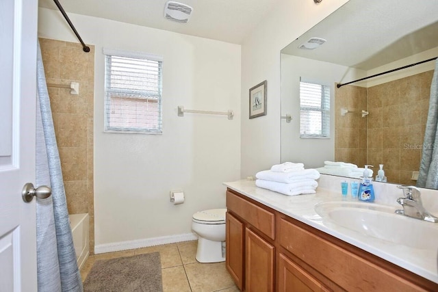 full bathroom featuring toilet, tile patterned flooring, vanity, baseboards, and shower / tub combo