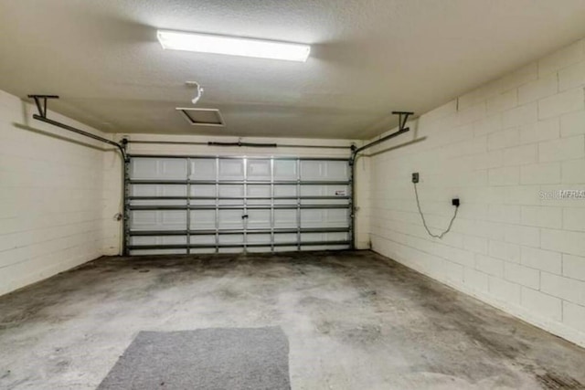 garage featuring concrete block wall