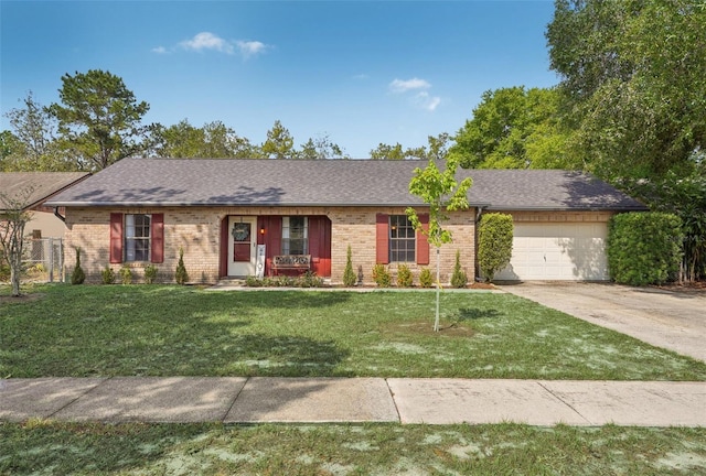 620 Fruitwood Ave, Winter Springs, FL 32708 - ranch-style home with concrete driveway, an attached garage, brick siding, and roof with shingles
