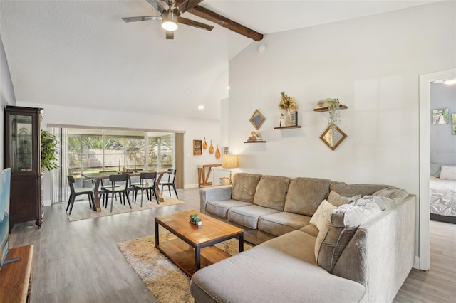 620 Fruitwood Ave, Winter Springs, FL 32708 - living room with a ceiling fan, beamed ceiling, wood finished floors, and high vaulted ceiling